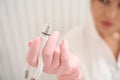 Woman cosmetologist holds in her hand a CO2 laser