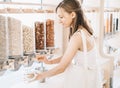 Zero waste shop. Girl buying in sustainable plastic free grocery store Royalty Free Stock Photo