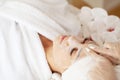 Woman with cotton face mask in beauty salon Royalty Free Stock Photo