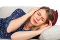 Woman on the couch having a headache Royalty Free Stock Photo