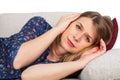 Woman on the couch having a headache Royalty Free Stock Photo