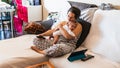 Woman on the couch with her baby Royalty Free Stock Photo