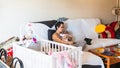 Woman on the couch with her baby Royalty Free Stock Photo