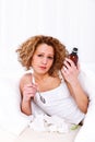Woman with cough syrup Royalty Free Stock Photo