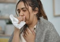 Woman with cough, tissue and sick with health problem, flu or allergies, chest pain and asthma at home. Young female Royalty Free Stock Photo