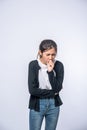 A woman coughing and covering her mouth with her hand Royalty Free Stock Photo