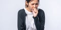 A woman coughing and covering her mouth with her hand Royalty Free Stock Photo