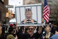 Woman Counter Protester with a Sign of Trump in Jail Outside the Courthouse during the Trump Indictment in New York City