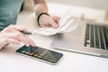 Woman making audit of household spendings at home, using calculator Royalty Free Stock Photo