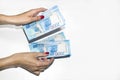 A woman`s hand holds paper money. Russian rouble Royalty Free Stock Photo