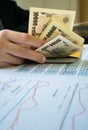 Woman is counting money with statement paper financial concept. Royalty Free Stock Photo