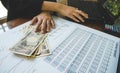 Woman is counting money with statement paper and use computer financial concept. Royalty Free Stock Photo