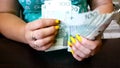 The woman counts the money. Close up of female hands count money cash. Money, Payment, Finance, Investment and Success, Concept. C