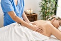 Woman couple having back massage at beauty center