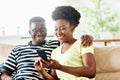 woman couple man happy happiness love black young lifestyle together romantic boyfriend girlfriend smartphone mobile Royalty Free Stock Photo