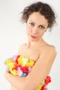 Woman cover her naked body by flower garland