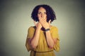 Woman covering closed mouth with hands. Speak no evil concept Royalty Free Stock Photo