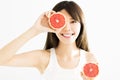 Woman covering her eye with grapefruit Royalty Free Stock Photo