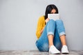 Woman covering her face with tablet computer Royalty Free Stock Photo