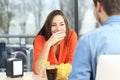 Woman covering her mouth to hide smile or breath Royalty Free Stock Photo