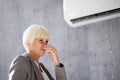 Woman Covering Her Nose From Bad Smell Inside Royalty Free Stock Photo