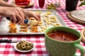 Woman covers dough letters