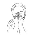 Woman covers her face with her hands and sneezes