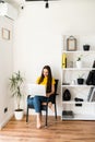 Woman in a cozy home atmosphere with a laptop Royalty Free Stock Photo