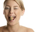 Woman cracking walnut with her teeth Royalty Free Stock Photo