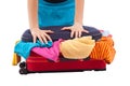 Woman crammed full of clothes in red suitcase Royalty Free Stock Photo
