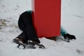 The woman crashed at high speed into a foam barrier on a pole near the ski slope. She is injured, but saved by a red protective ma Royalty Free Stock Photo