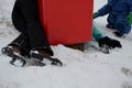 The woman crashed at high speed into a foam barrier on a pole near the ski slope. She is injured, but saved by a red protective ma Royalty Free Stock Photo