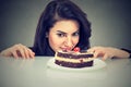 Woman craving cake dessert, eager to eat sweet food Royalty Free Stock Photo