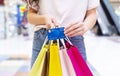Woman with credit card making purchases in shopping center Royalty Free Stock Photo