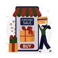 Woman with credit card paying for purchase. Cute girl shopping to Christmas in mobile app. Happy person buying presents