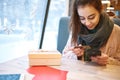 Woman with credit card and phone