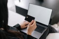 Woman with credit card using laptop, closeup Royalty Free Stock Photo