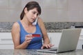 Woman with creditcard and laptop Royalty Free Stock Photo