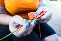 Woman crocheting. Hand craft work using crochet hook. Knitting rug