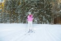 Woman cross country skiing in forest Royalty Free Stock Photo