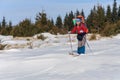 A woman cross country skiing in the mountain Royalty Free Stock Photo