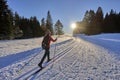 Woman cross-country skiing short before sunset in the Bregenz Forest Mountains Royalty Free Stock Photo