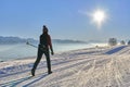 Woman cross-country skiing short before sunset in the Bregenz Forest Mountains Royalty Free Stock Photo