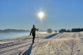 Woman cross-country skiing short before sunset in the Bregenz Forest Mountains Royalty Free Stock Photo