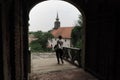 Woman Crosses Gate In Petrovaradin Fortress, Serbia