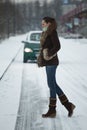 Woman crossing the road before car