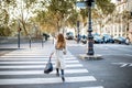 Woman crossing the street in Paris Royalty Free Stock Photo