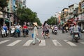 Woman Crossing Street In Vietnam