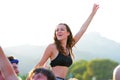 A woman from the crowd cheering in a daylight concert at FIB Festival Royalty Free Stock Photo