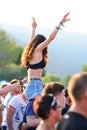 A woman from the crowd in a daylight concert at FIB Festival Royalty Free Stock Photo